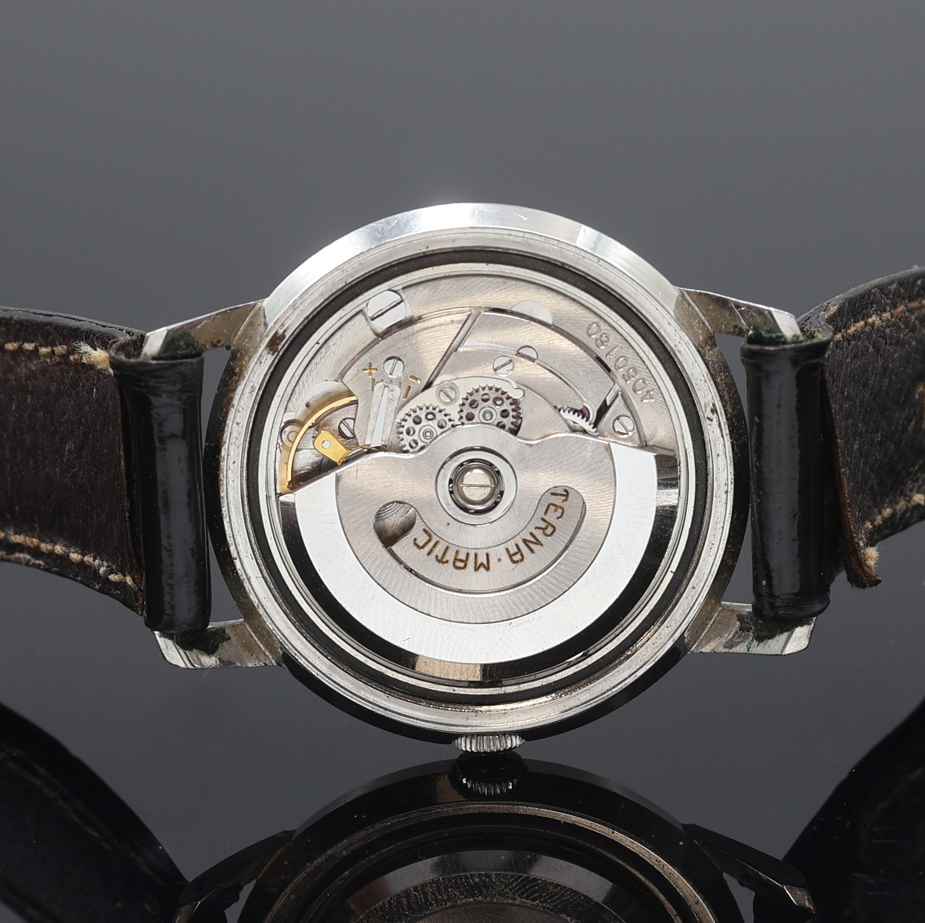Detail e: ETERNA-MATIC Herrenarmbanduhr in Stahl, Schweiz um 1960, Automatik, Boden verschr., silb. Zifferbl. pat./fl., gold. Std.-Ind., silb. Leuchtzeiger, ...
