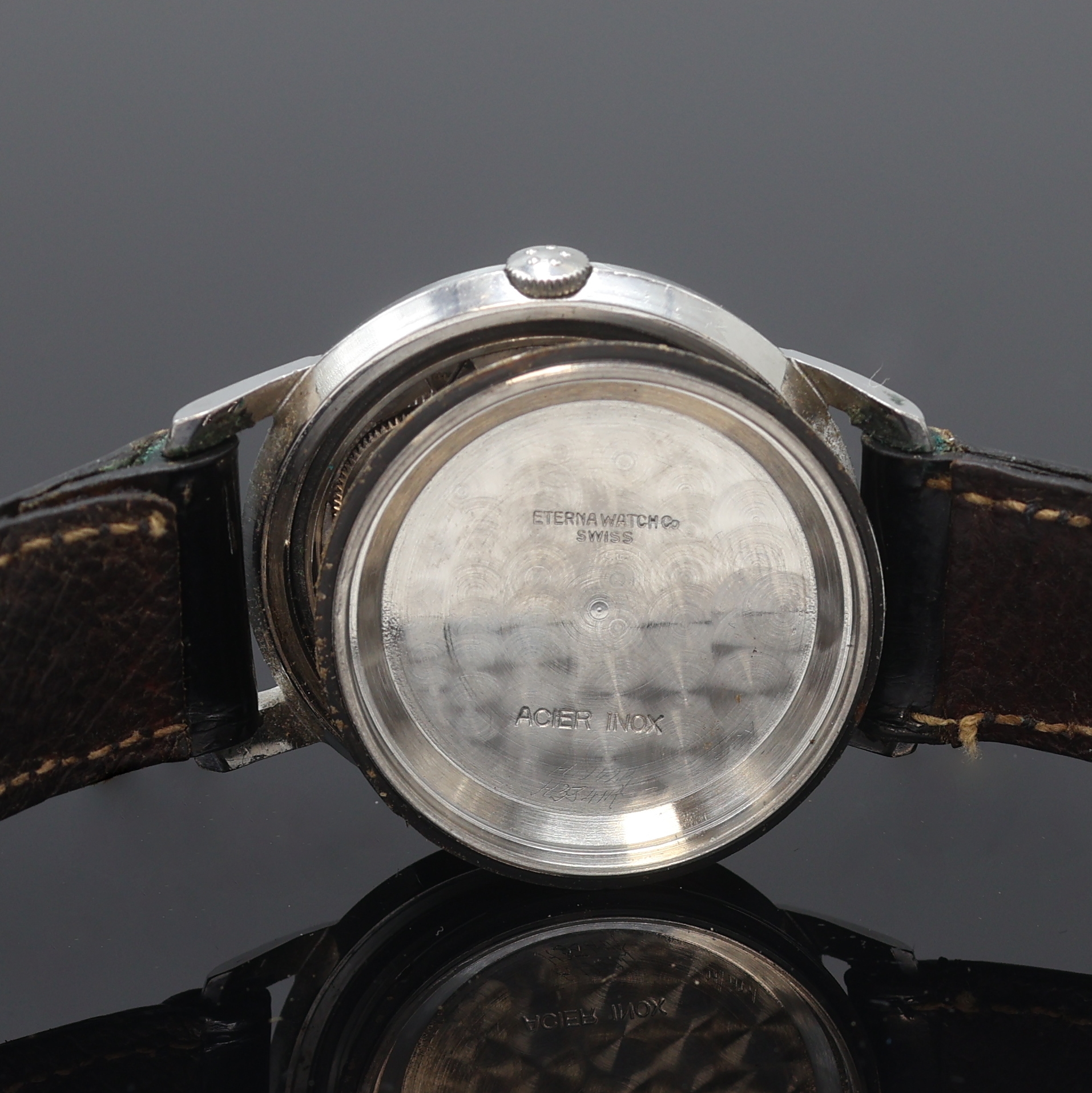 Detail f: ETERNA-MATIC Herrenarmbanduhr in Stahl, Schweiz um 1960, Automatik, Boden verschr., silb. Zifferbl. pat./fl., gold. Std.-Ind., silb. Leuchtzeiger, ...