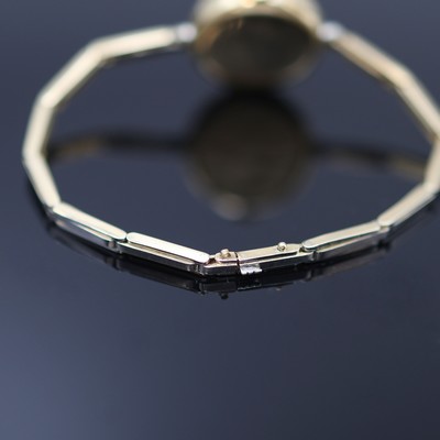 27118000c - Frühe mit Diamanten besetzte Armbanduhr in GG 750/000, Schweiz um 1920, Handaufzug, z. ...