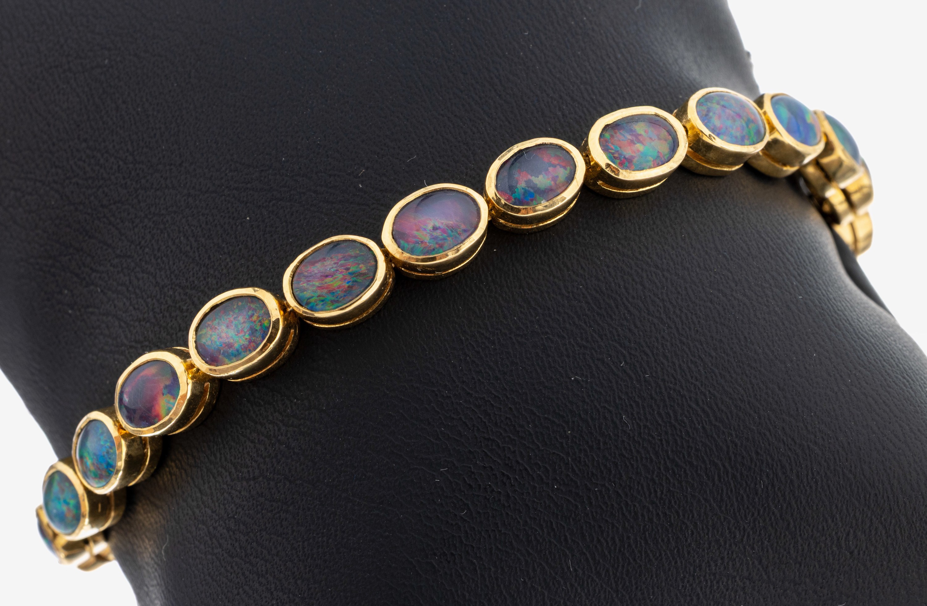 Image 27118297 - 18 kt Gold Opal-Armband, GG 750/000, 22 ovale Opaltripletten, L. ca. 19.5 cm, ...