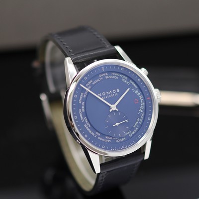 27119038b - NOMOS ungetragene Herrenarmbanduhr Zürich Weltzeit Referenz 807, Automatik, beids. ...