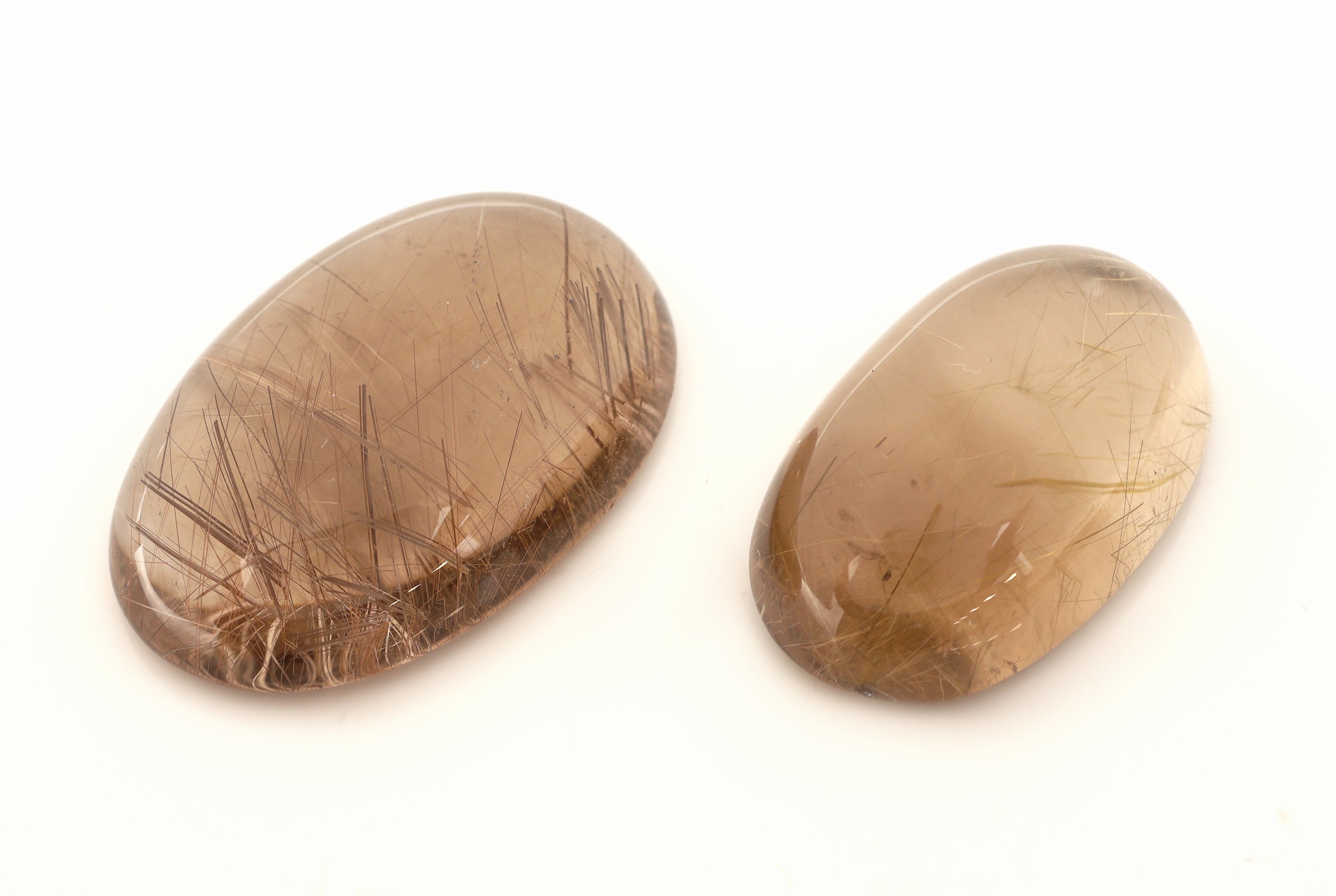 Image 27121531 - Lot 2 lose Rutilquarz Cabochons zus. 163.26 ct, oval, in versch. Größen Schätzpreis: ...