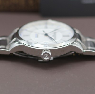 27124006d - BAUME & MERCIER Classima Dual Time ungetragene Herrenarmbanduhr Referenz M0A10273, ...