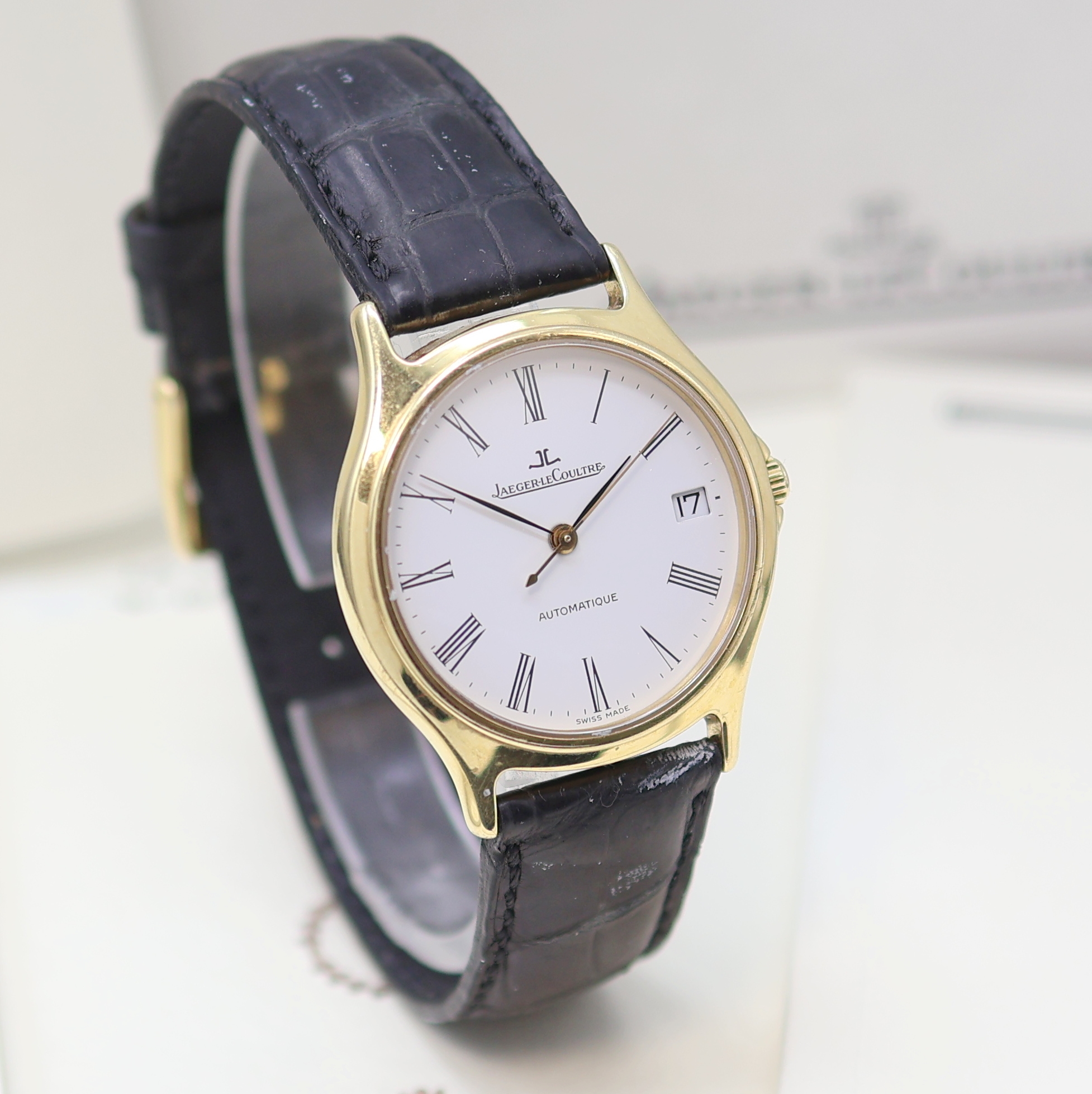 Detail b: Jaeger-LeCoultre Heraion Armbanduhr in GG 750/000, Schweiz verk. lt. beil. Pap. 03/1994, Automatik, Boden 4-fach verschr., weißes Zifferbl. m. röm. ...