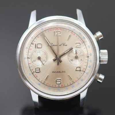 27125445a - MARCEL ET CIE verchromter Armbandchronograph mit Kaliber Valjoux 7733, Schweiz um 1970, ...