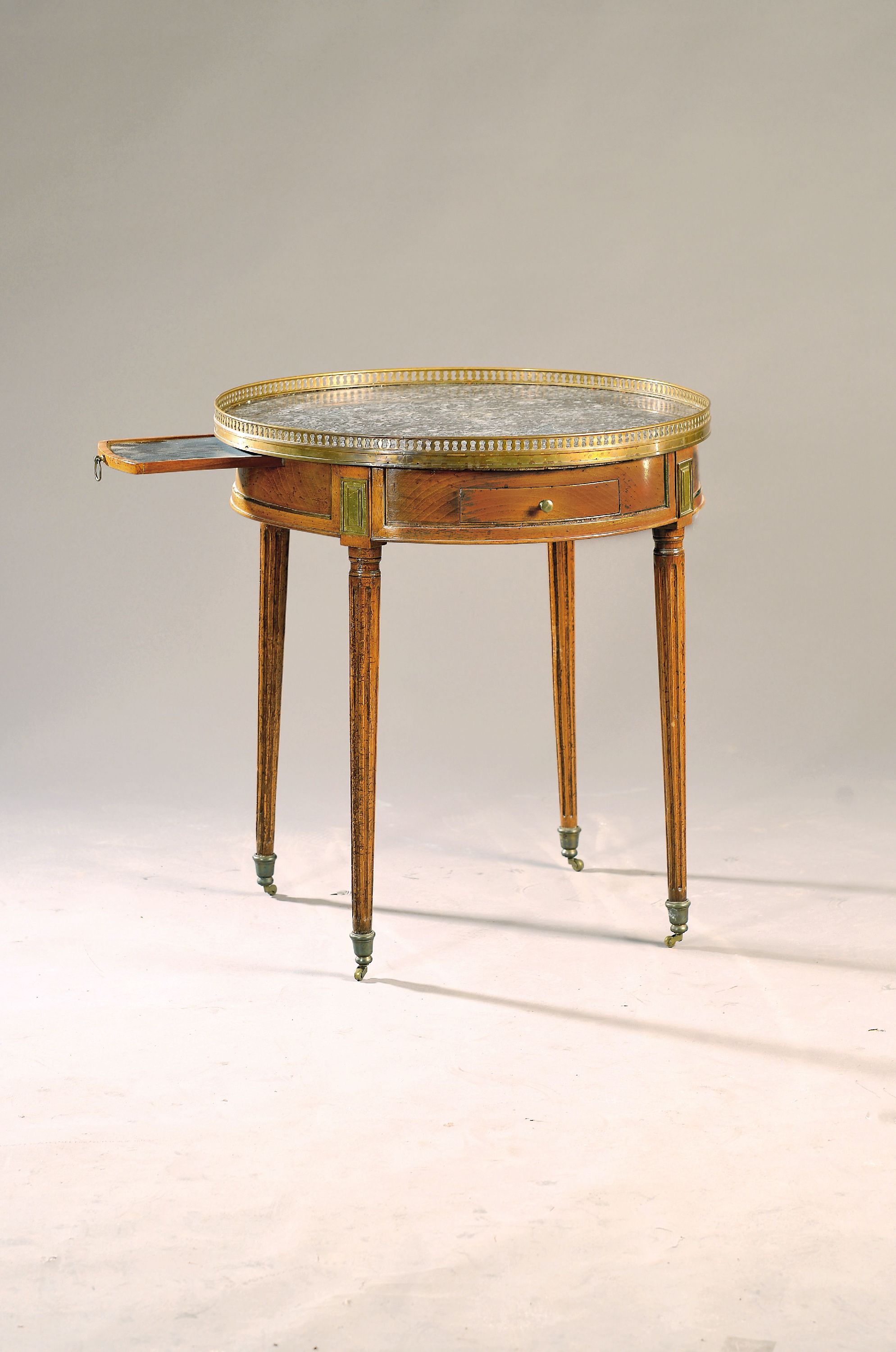 Image 27131535 - Salon table, France, 19th century, walnut, gray marble top, fluted feet, brass gallery, ...