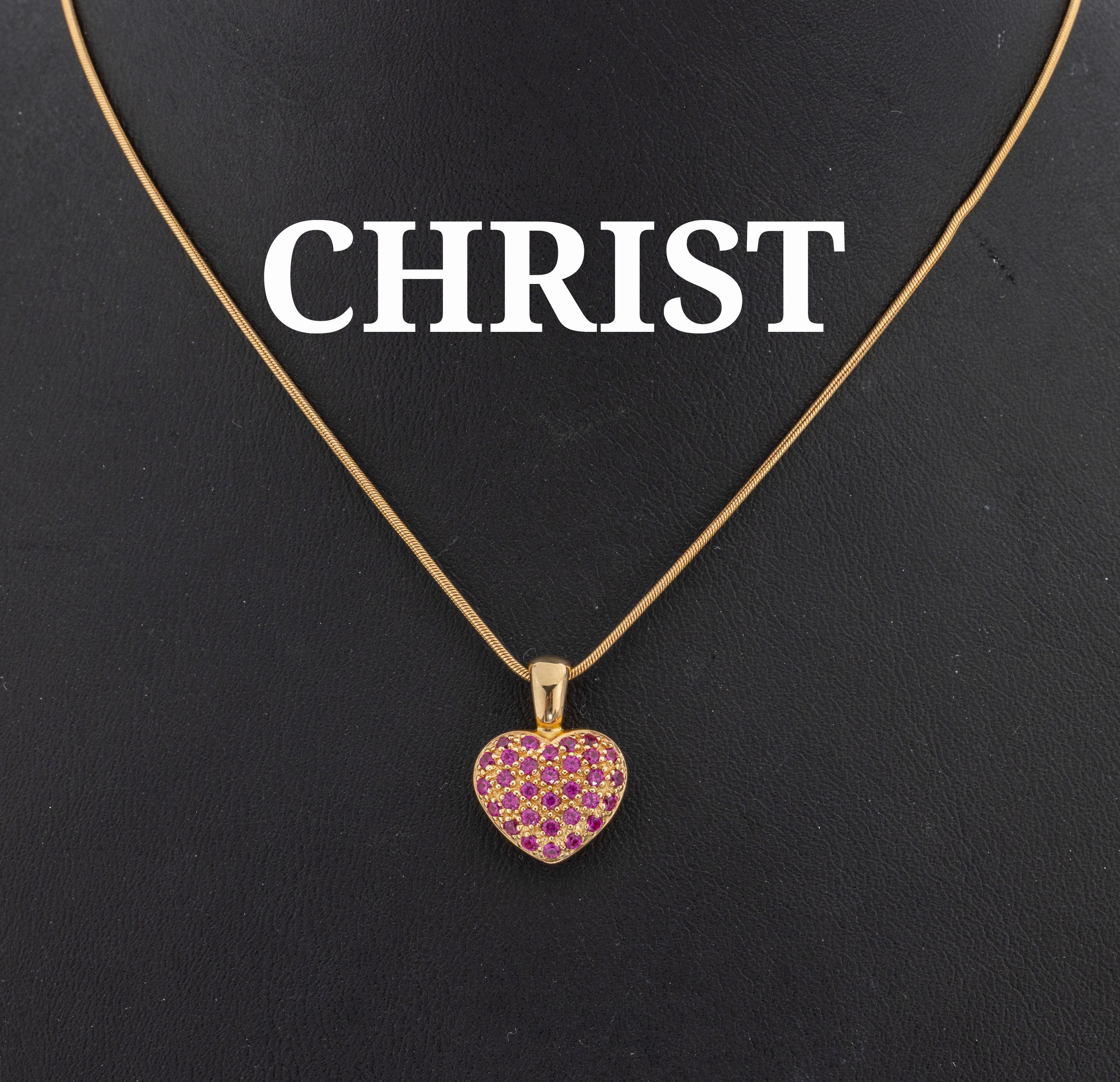 Image 27134514 - 14 kt Gold CHRIST Rubin-Herzanhänger, GG 585/000, 31 rundfacett. Rubinen zus. ca. 0.60 ...
