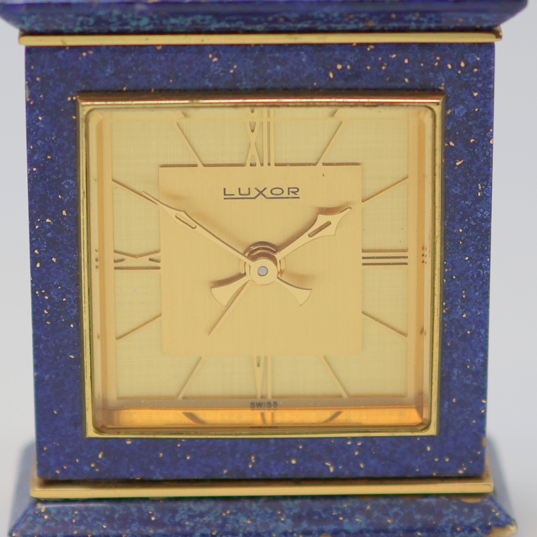 Detail a: LUXOR Tischuhr mit Wecker, Schweiz um 1975, Aufzug, Zeigerstellung sowie Weckzeit rücks. im Geh., verg. Messinggeh. m. blauem Lack (teils besch.), ...