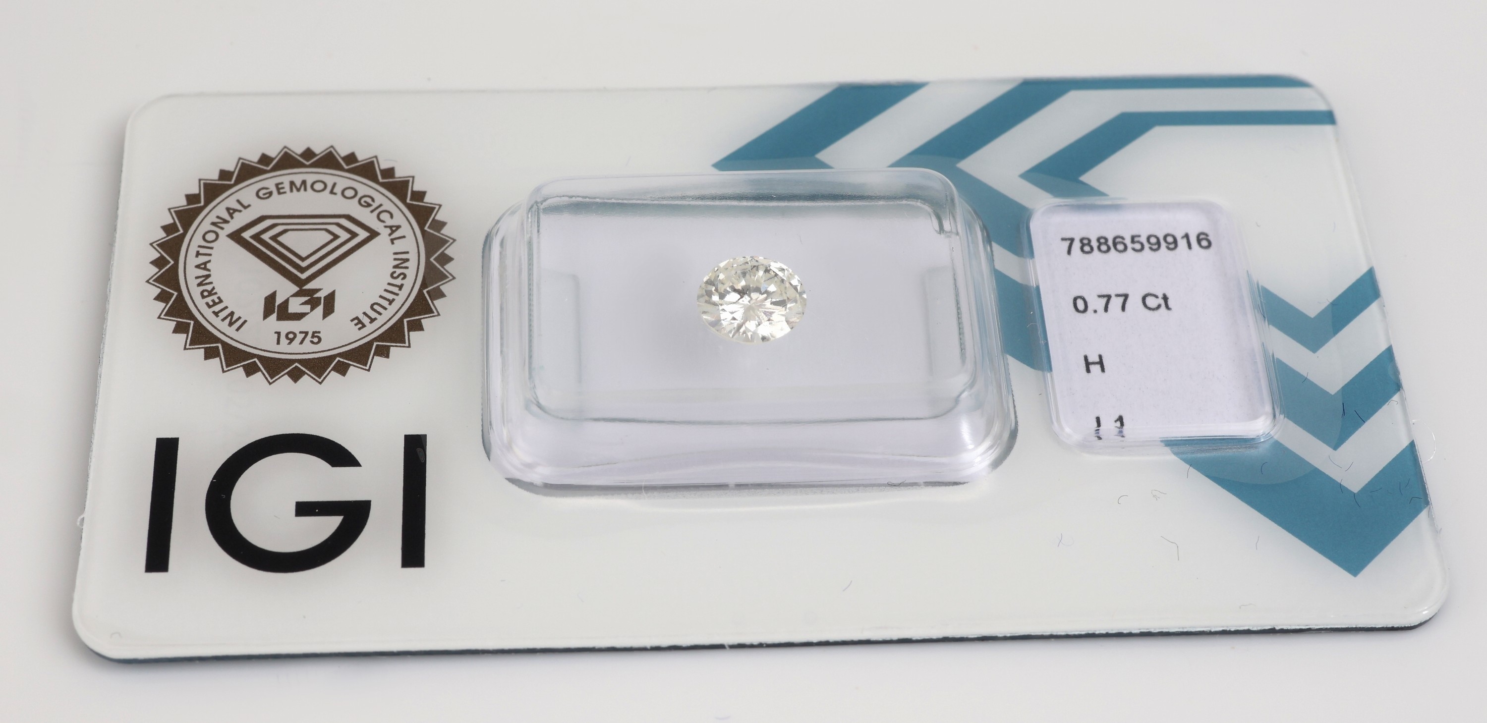 Detail a: Loser Brillant, 0.77 ct Weiß(H)/p2, eingeschweißt, IGI-Expertise anbei