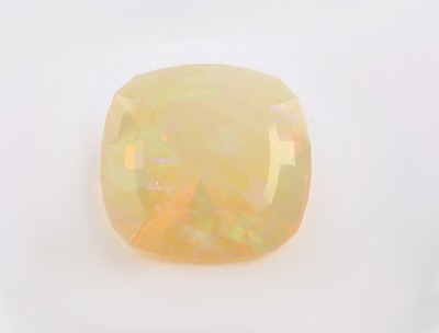 27138238b - Loose opal , 21.87 ct, cushion-cut, nice play of colours Valuation Price: 1400, - EUR