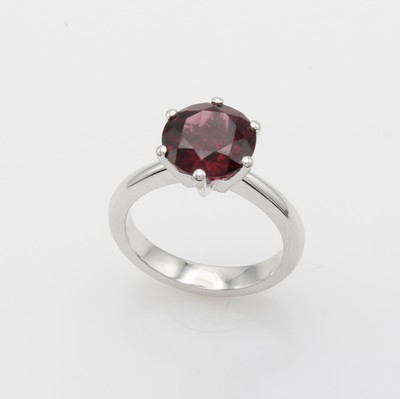27164131a - Ring mit Rhodolith, WG 750/000, Rhodolith in Krappenfassung, RW ca. 55 Schätzpreis: ...